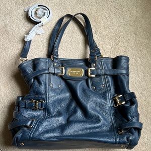 Michael Kors bag very good (carried once or twice) condition.